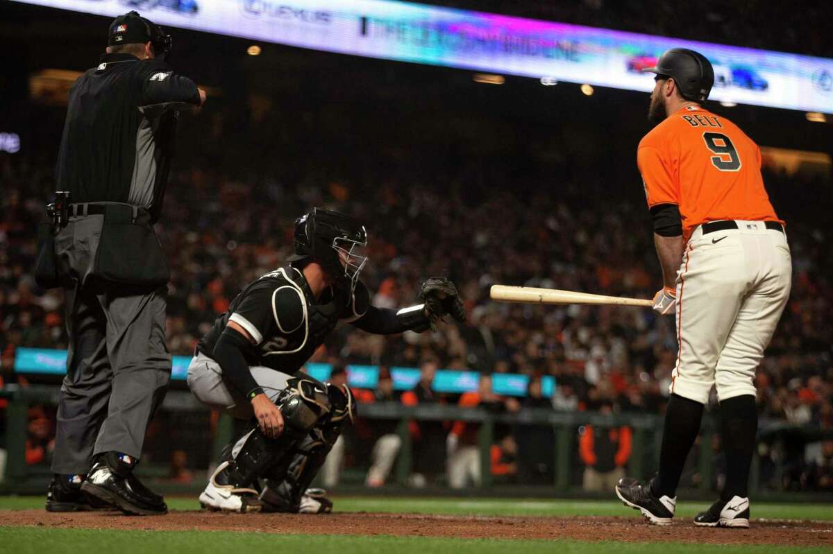 San Francisco Giants first baseman Brandon Belt (9) reacts to being called out on strikes by home plate umpire Jordan Bake during the eighth inning of a baseball game against the Chicago White Sox on Friday, July 1, 2022 in San Francisco, Calif.