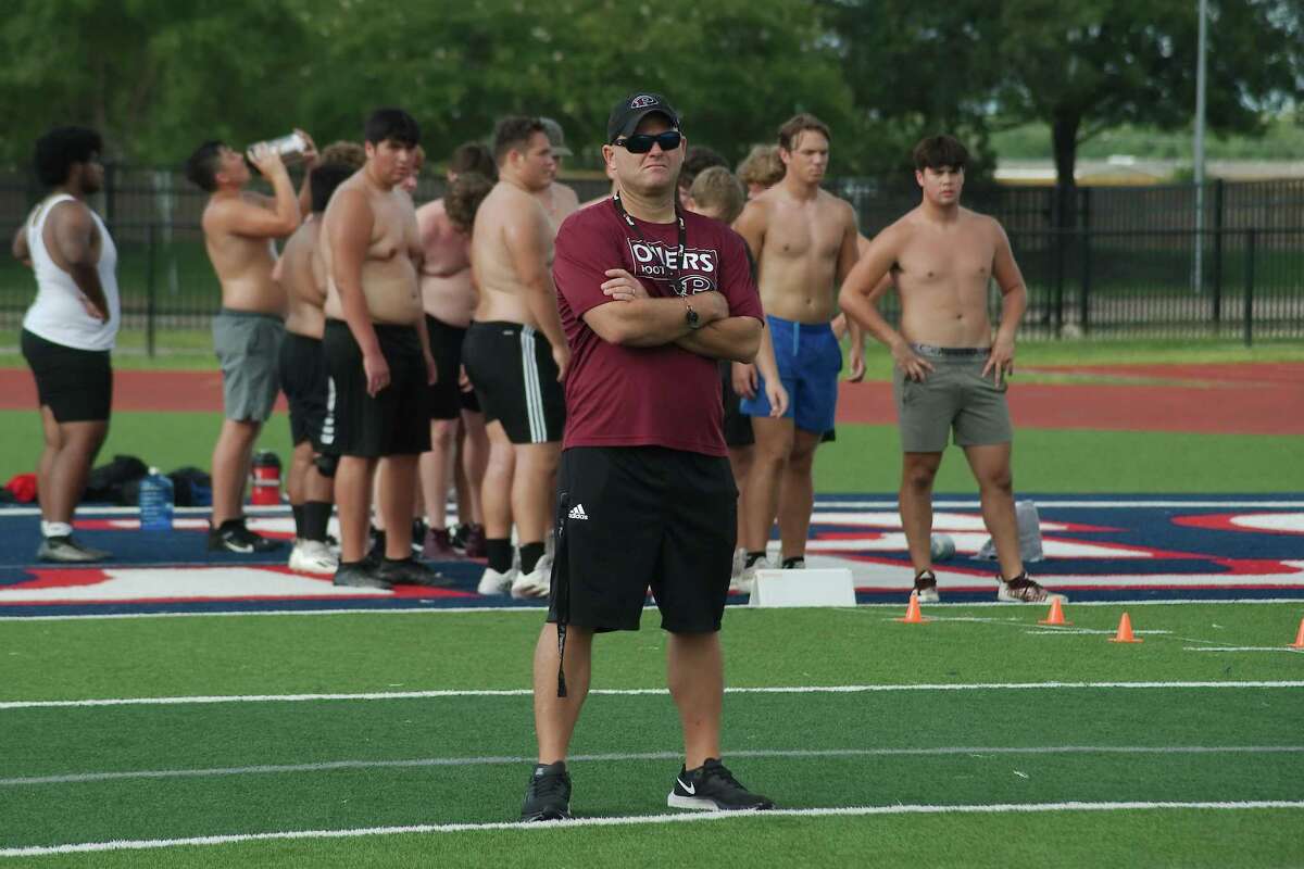 First-year Pearland head football coach B.J. Gotte observe his players during the Oilers’ summer conditioining camp which continues through July.