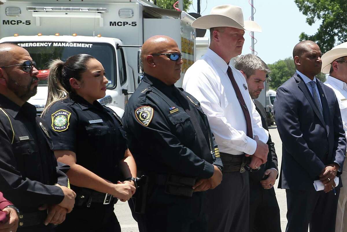 Uvalde CISD Police Chief Pete Arredondo, third from left, listens as Texas Department of Public Safety South Texas regional director Victor Escalon gives a news conference May 26 providing an update on the mass shooting at Robb Elementary School.