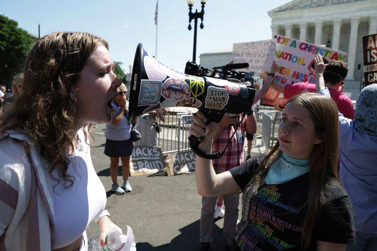 An antiabortion activist (left) argues with an abortion rights supporter outside the U.S. Supreme Court last month.