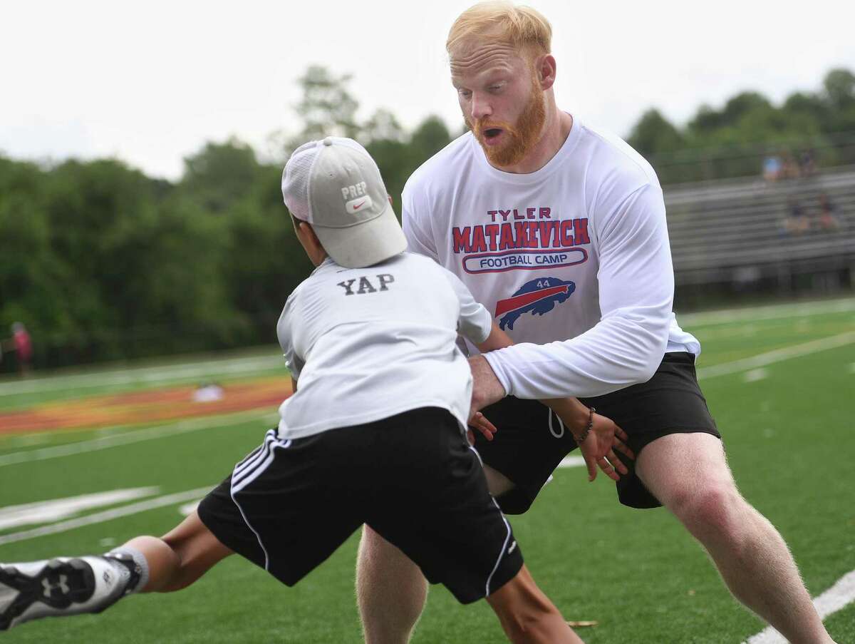 Buffalo Bills linebacker and former St. Joseph High School standout Tyler Matakevich challenges receivers off the line at his Tyler Matakevich Football Camp in Trumbull on Saturday.