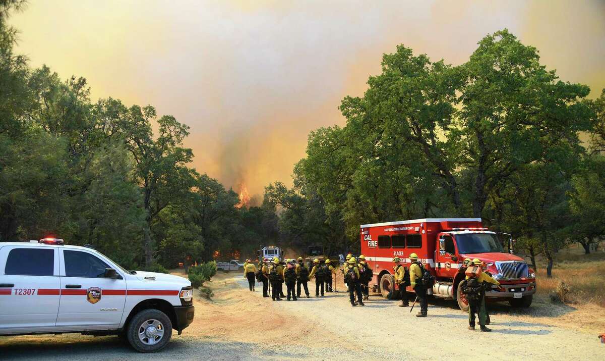 A Cal Fire hand crew prepares to attack the Rices Fire Tuesday, June 28, 2022, off of Troost Trail, in North San Juan, Calif.