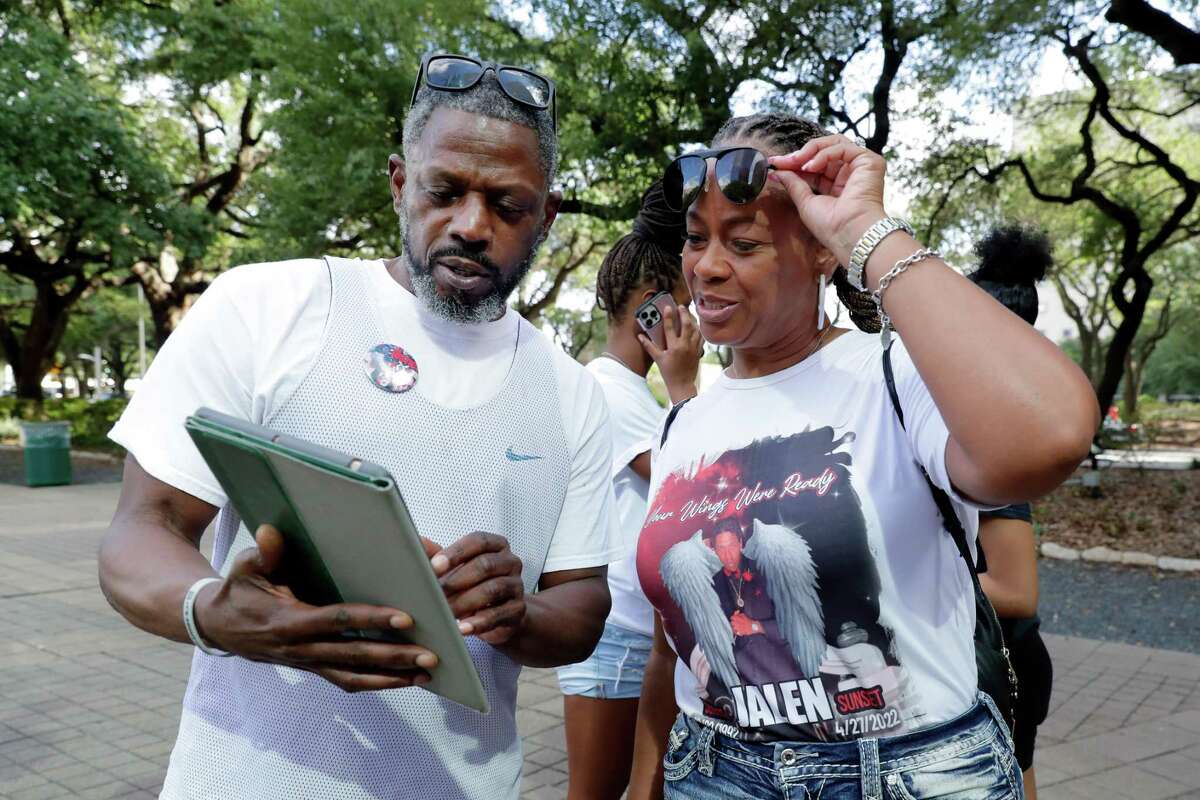 Paul Randle, left, cousin of Jalen Randle, and Tiffany Rachal, right, mother of Randle, gather with some 50 demonstrators before they march from city hall to the Houston Police Department headquarters in protest of the police shooting of Jalen Randle Saturday, July 2, 2022 in Houston, TX.