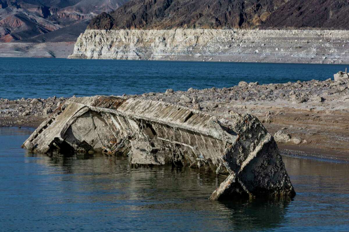 A WWII-era landing craft used to transport troops or tanks was revealed on the shoreline near the Lake Mead Marina as the waterline continues to lower at the Lake Mead National Recreation Area on Thursday, June 30, 2022, in Boulder City. (L.E. Baskow/Las Vegas Review-Journal via AP)
