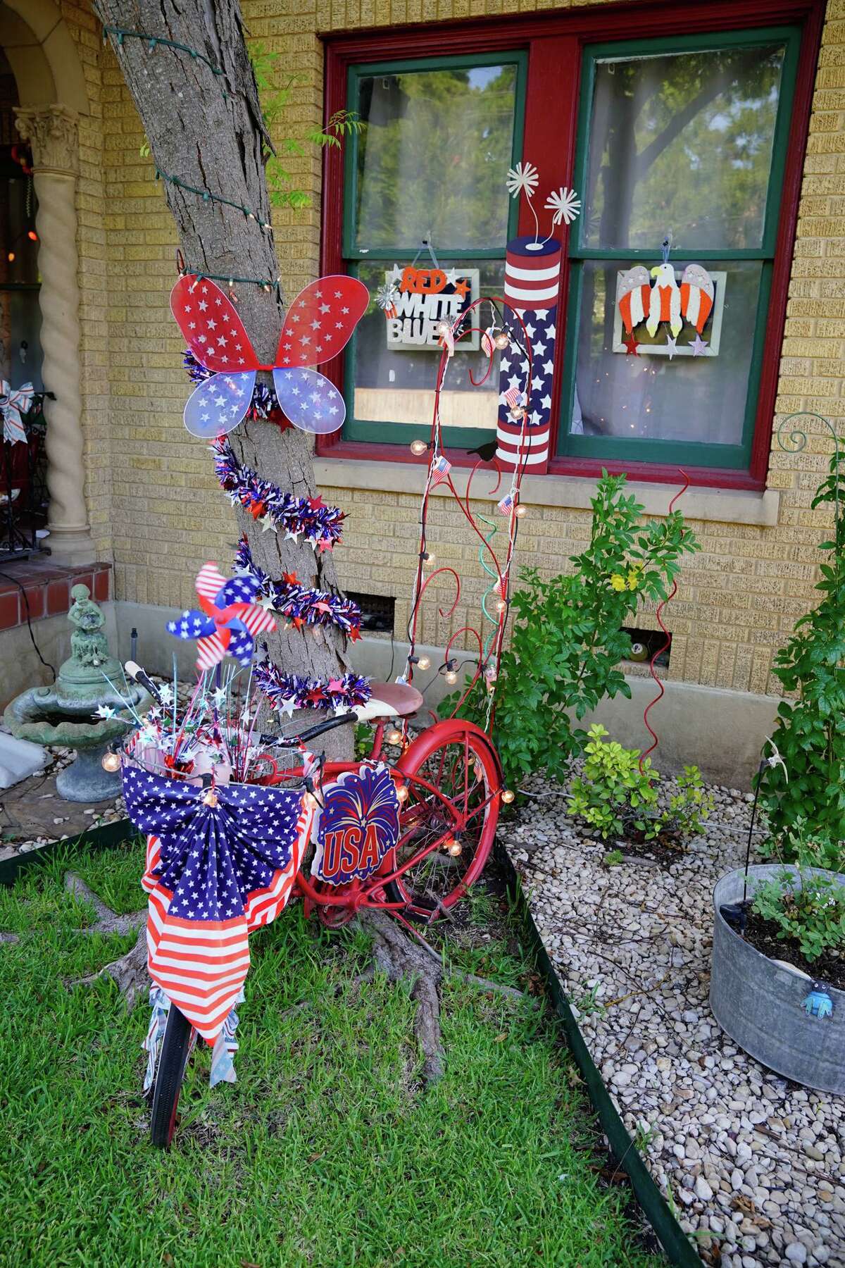 Bicycles are part of the patriotic theme in front of the home of Annie and Joseph Ramirez. Annie said she decorates for every holiday, including Fiesta.