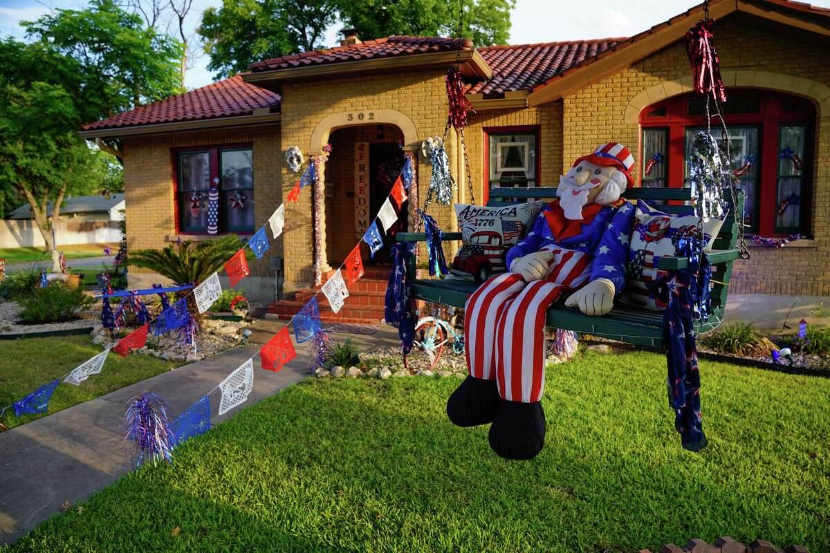 Uncle Sam dolls hang from the tree’s with a patriotic theme in front of the home of Annie and Joseph Ramirez. Annie said she decorates for every holiday, including Fiesta.
