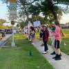 More than 50 people gathered at Roger's Park Saturday evening -- holding signs and chanting so loud, they could be heard in some nearby subdivisions.