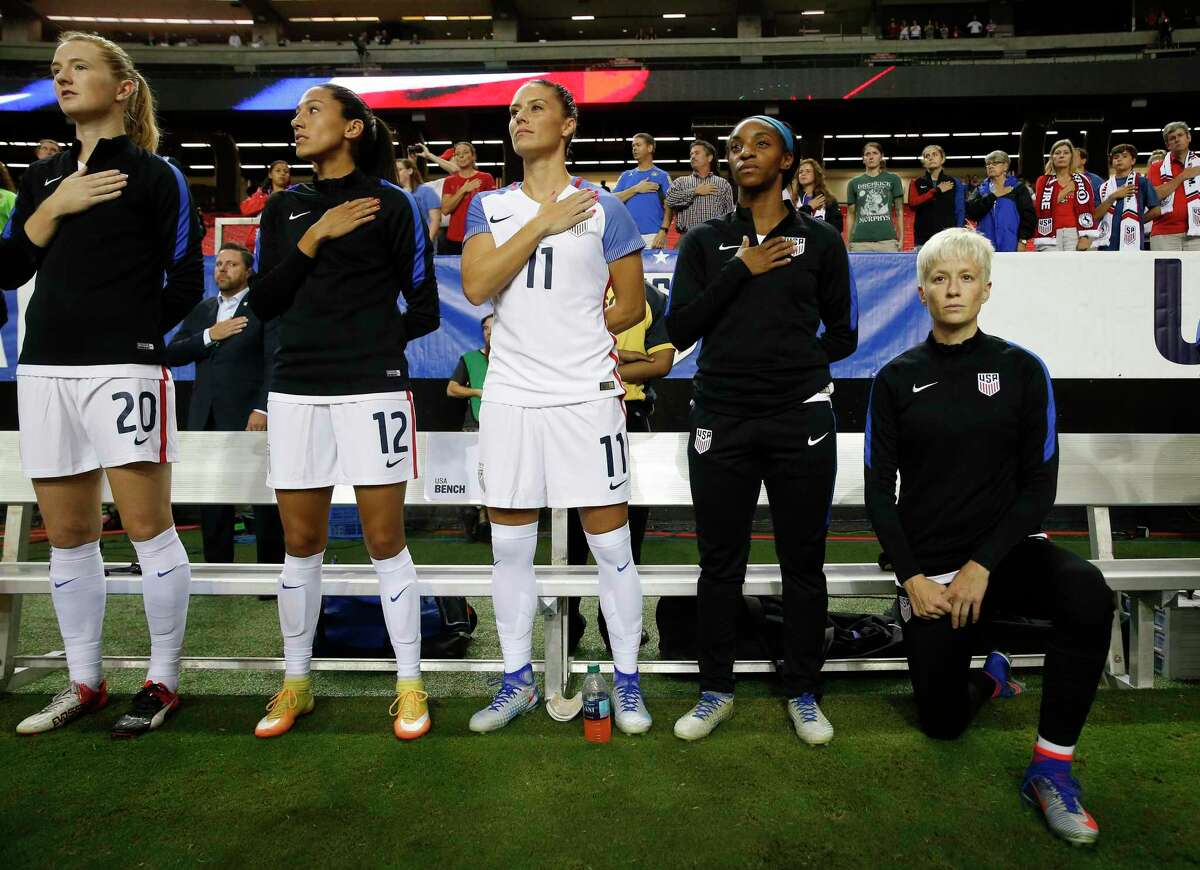 U.S. soccer player Megan Rapinoe kneels before an exhibition match against the Netherlands in Atlanta in 2016.