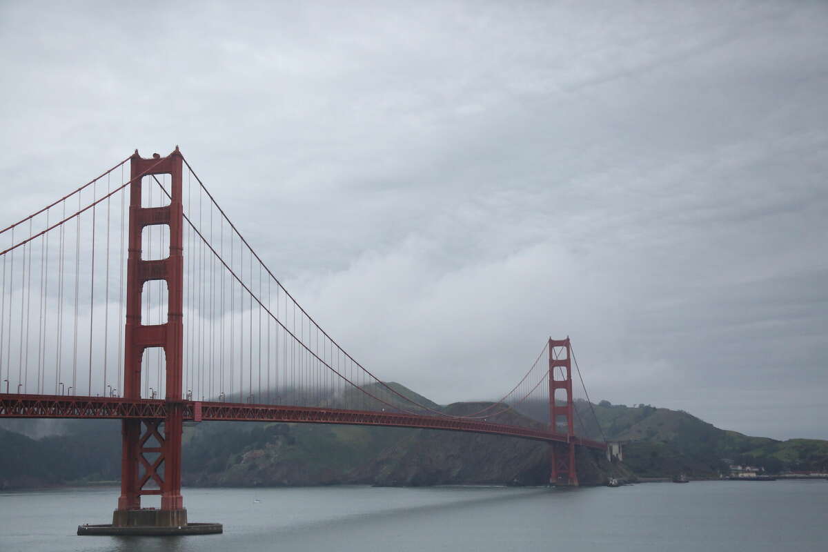 Downtown San Francisco experienced a near record breaking amount of rainfall over the weekend, and cloudy conditions are on the way. This file photo shows the Golden Gate Bridge cloaked in fog.