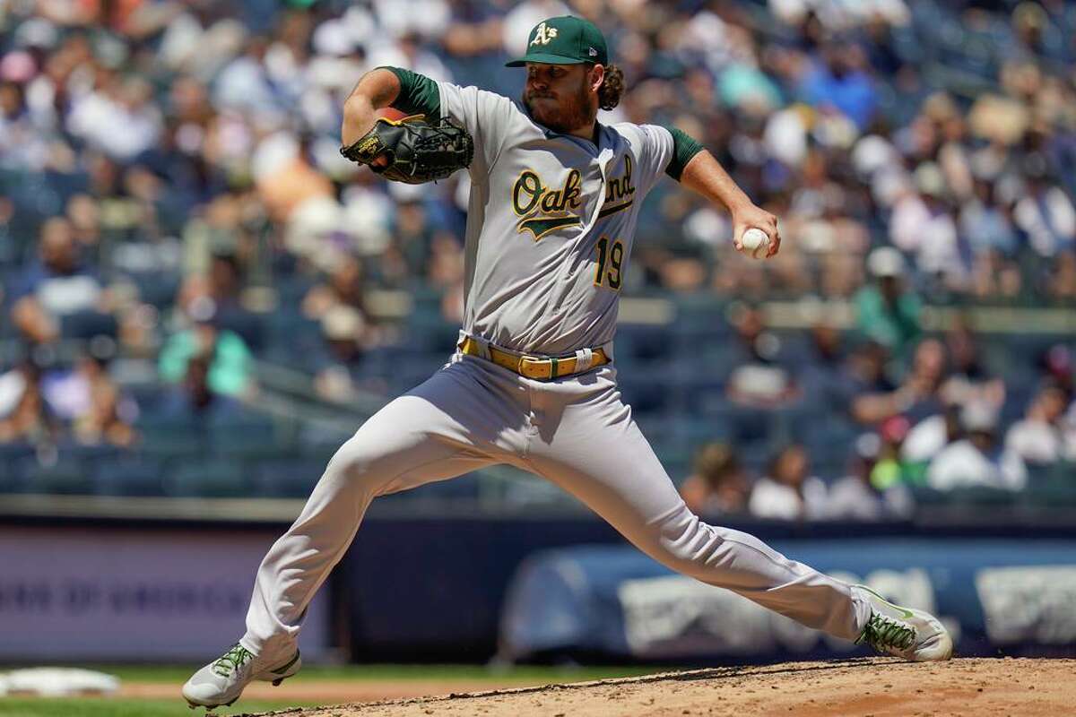 Oakland Athletics starting pitcher Cole Irvin throws during the second inning of a baseball game against the New York Yankees at Yankee Stadium, Wednesday, June 29, 2022, in New York.