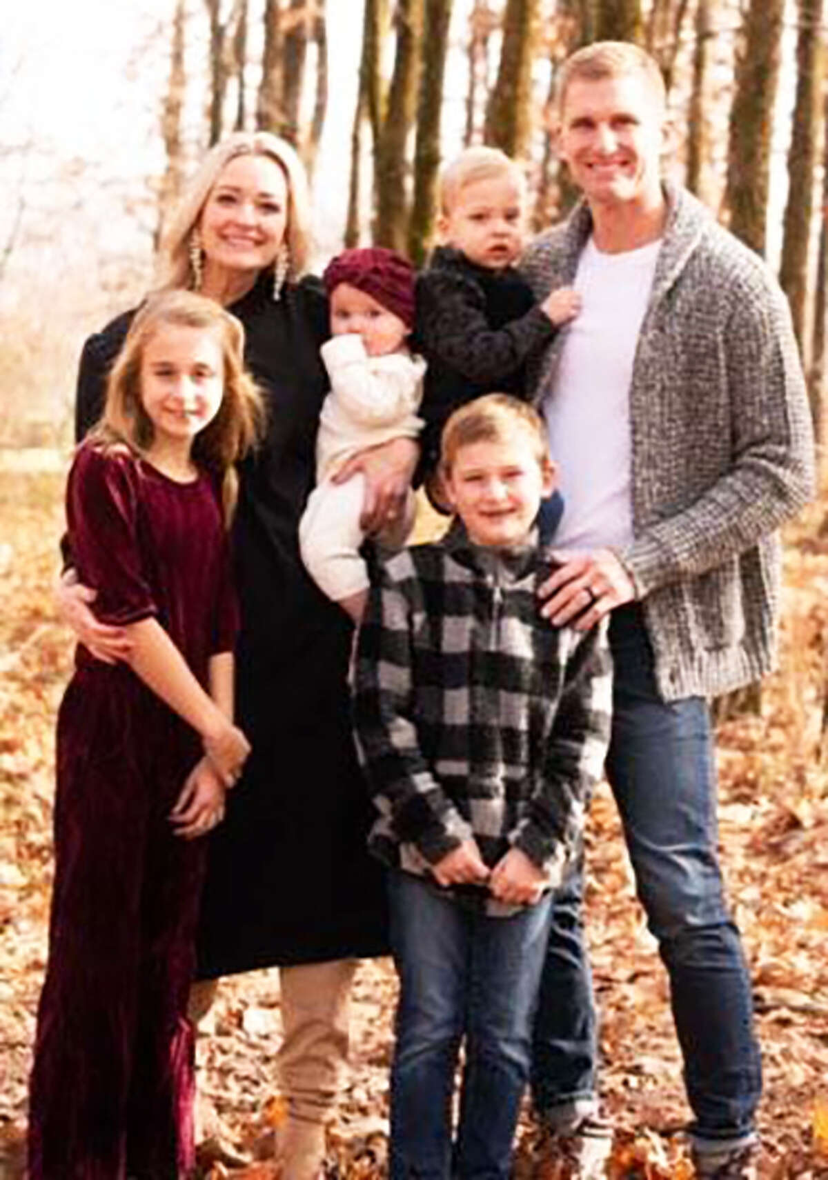 Former Edwardsville assistant football coach Scott Battas and his wife Kara with children Brynn, Beau, Baer and Britt.