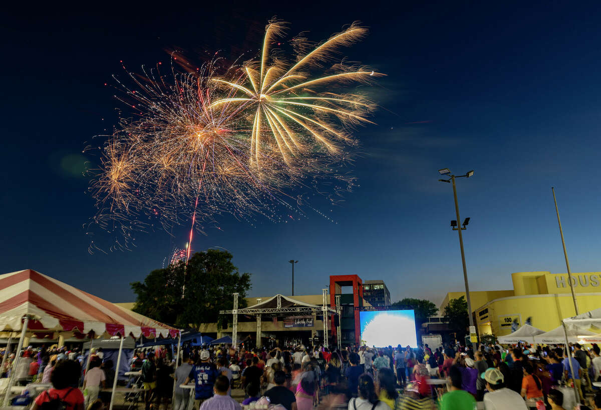 Fans watch the fireworks show at the Liberty Fest at PlazAmericas Shopping Centre on July 3, 2022 in Houston.