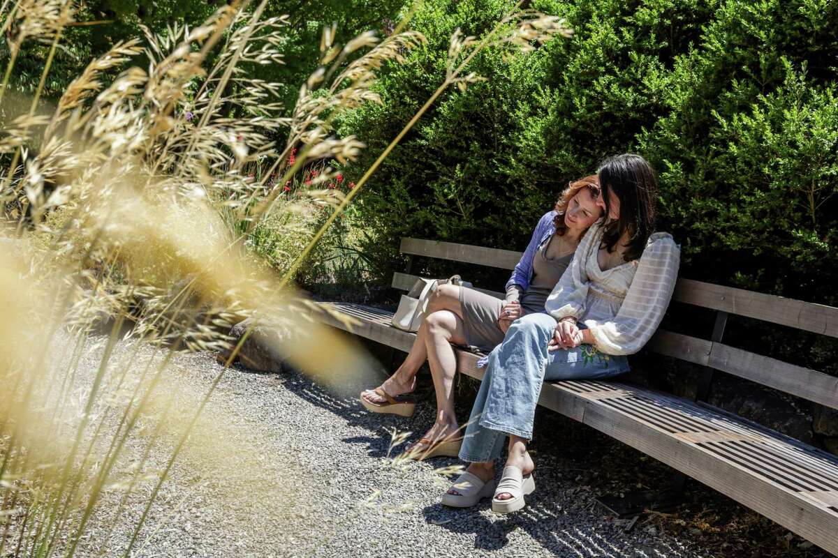 Beth Block (left) and her daughter Kate, 17, relax at the Marin Art and Garden Center in Ross, which has just been named to the National Register of Historic Places.