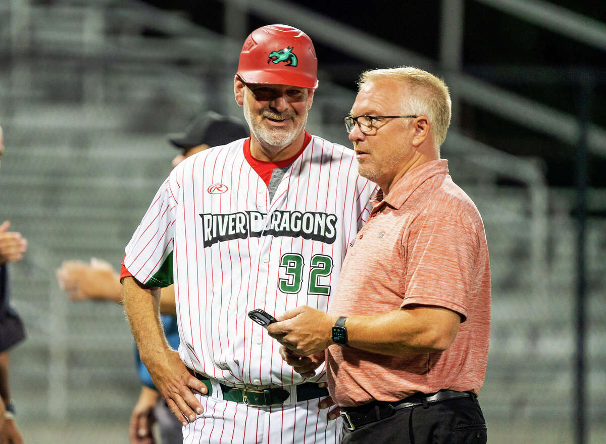 River Dragons field manager Darrell Handelsman, left, and general manager Dallas Martz talk before a recent game at Lloyd Hopkins Field. The Dragons clinched the first-half title of the Prospect League Prairie Land Division Saturday, then beat Cape Girardeau Sunday, also at Hopkins Field.