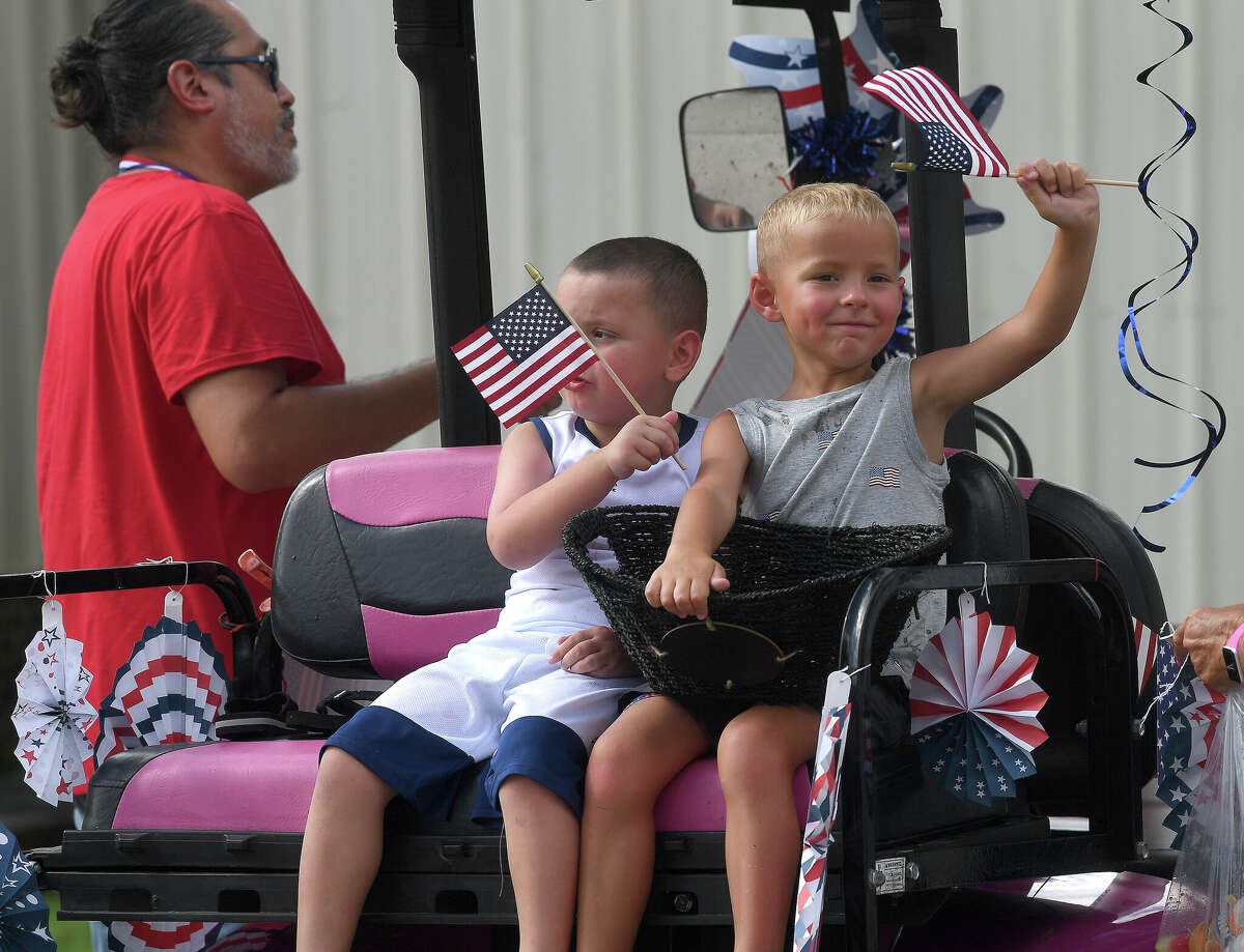 Families continue to show their patriotic spirit after participating in the annual Calder Place 1929 Fourth of July parade through the neighborhood Monday. Photo made Monday, July 4, 2022. Kim Brent/The Enterprise