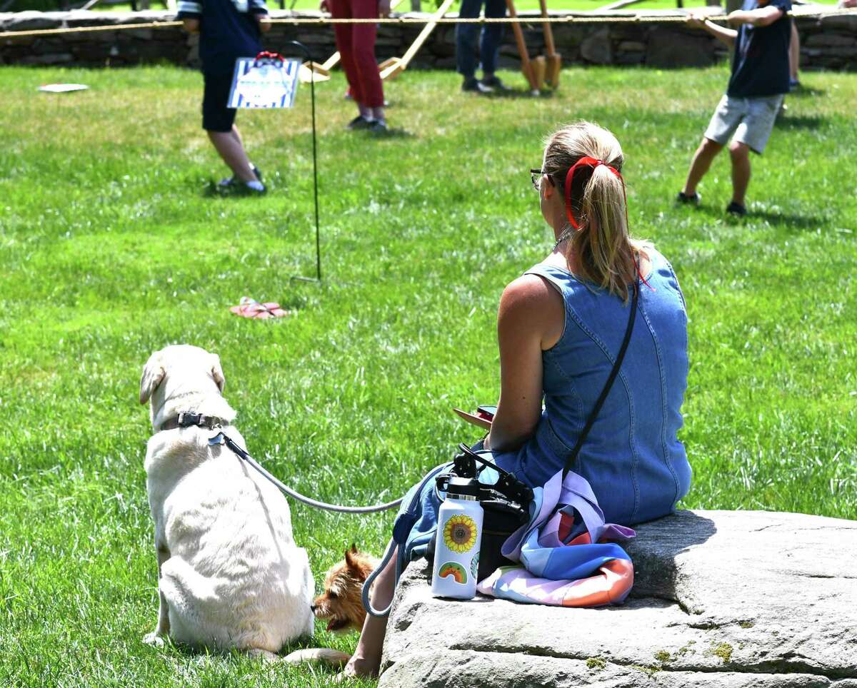 A guest and her dog take a break during the Litchfield Historical Society’s Pet Parade and Turn of Century Fest, held July 4, 2022 in Litchfield.