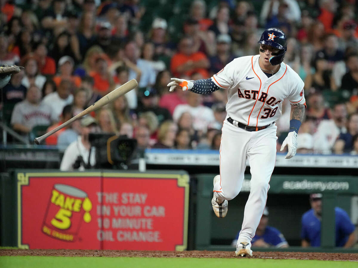 Houston Astros Korey Lee (38) tosses his bat as he was walked by Kansas City Royals relief pitcher Wyatt Mills during the seventh inning of an MLB game at Minute Maid Park on Saturday, July 2, 2022 in Houston.