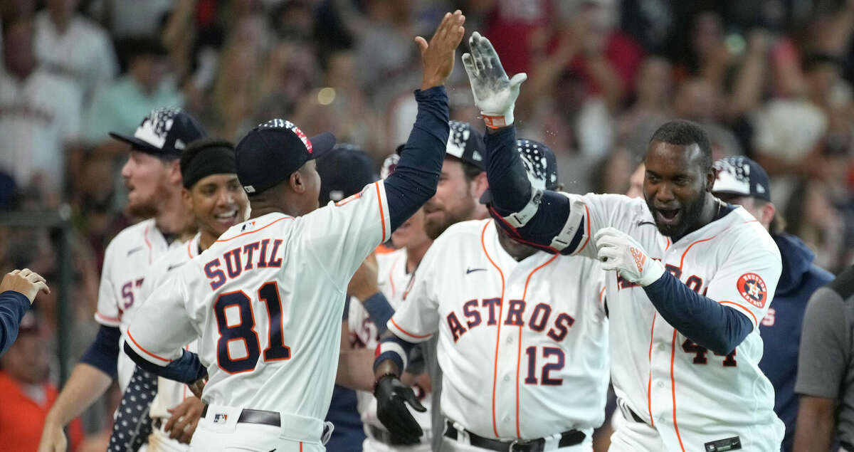 Houston Astros Yordan Alvarez (44) celebrates with Wladimir Sutil after hitting a walk off home run to beat the Kansas City Royals 6-7 during an MLB game at Minute Maid Park on Saturday, July 2, 2022 in Houston.