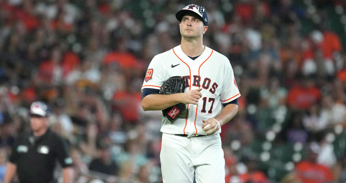 Houston Astros starting pitcher Jake Odorizzi (17) reacts after Kansas City Royals Andrew Benintendi's single during the fourth inning of an MLB game at Minute Maid Park on Saturday, July 2, 2022 in Houston.