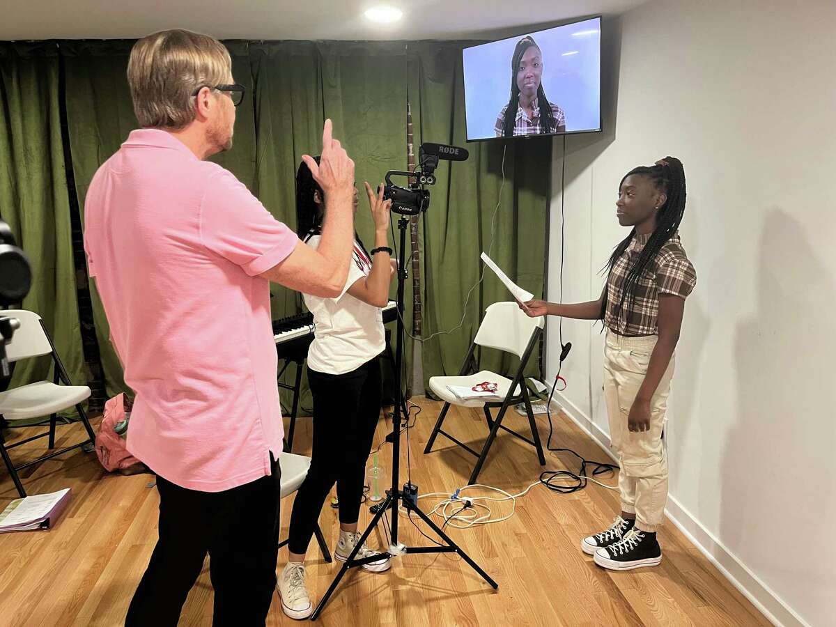 Joya Howard, 16, of Atlanta, Georgia, learns to act to a camera with direction from casting director Jeffrey Dreisbach (pink shirt) of McCorkle Casting, Ltd. on Thursday, June 30, 2022, at The Norwalk Conservatory of the Arts pre-college program.