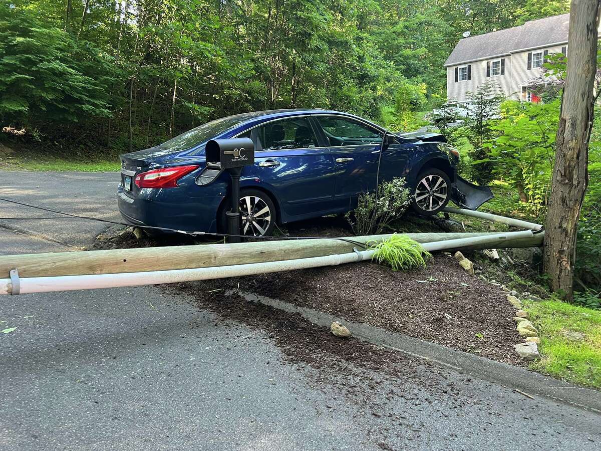 Police are investigating a Sunday crash in New Fairfield that took out a utility pole on Shortwoods Road and sent a woman to the hospital.
