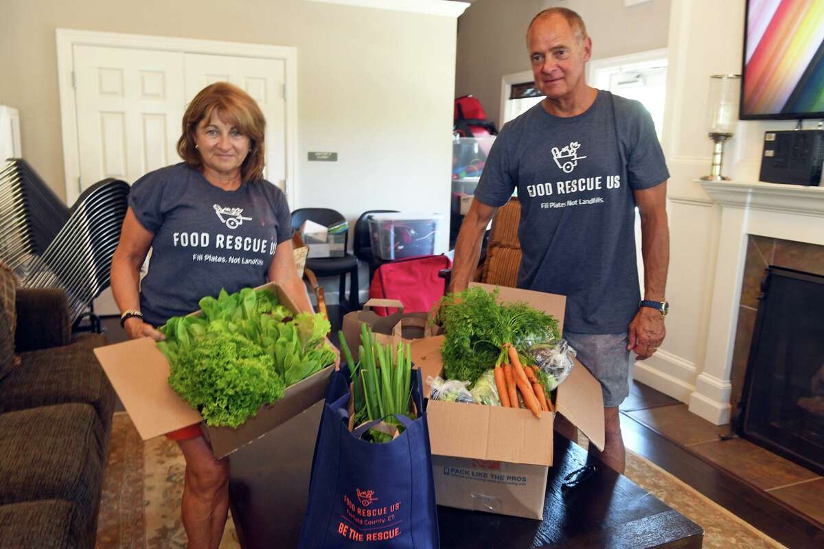 Susie and Daryl Kowalsky of Food Rescue U.S. on June 30 with fresh produce collected during their weekly delivery to the Westport Housing Authority’s community center at Hales Court.