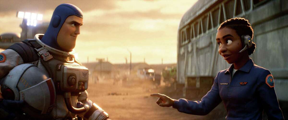 Buzz Lightyear, left, voiced by Chris Evans, and Alisha Hawthorne, voiced by Uzo Aduba, in a scene from the animated film "Lightyear." Hawthorne is part of the first significant same-sex couple in a Pixar feature.