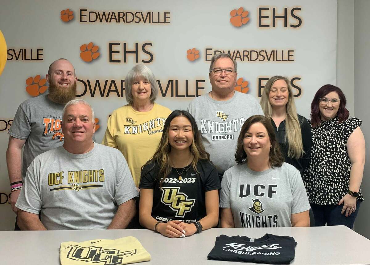 Edwardsville High School graduate Marcie Billings, seated center, will cheer for the University of Central Florida.
