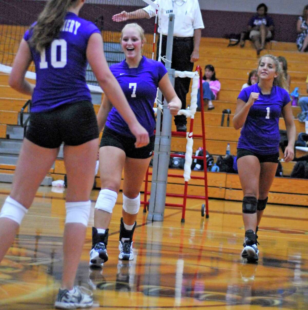 Lizzy Bache (#10) Stormi Champion (#7) and Caitlin Ogletree (#1) of Montgomery play against Spring Woods in the Katy ISD Varsity Volleyball Classic Thursday 8/13/09.