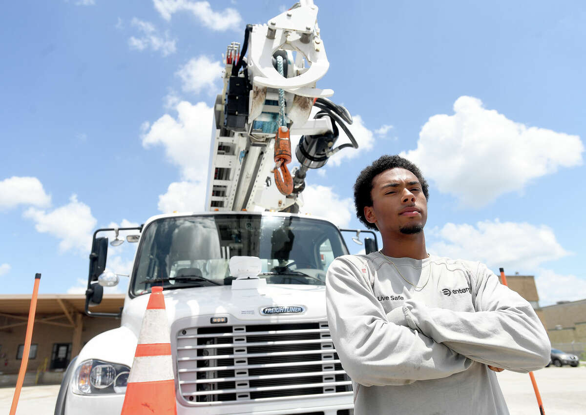 Entergy lineman Shawnn Henry went to lineman school right after turning 18. He's now one year into the job that he"fell in love with" after his father started taking him along on jobs to observe what a lineman does. Photo made Tuesday, July 5, 2022. Kim Brent/The Enterprise