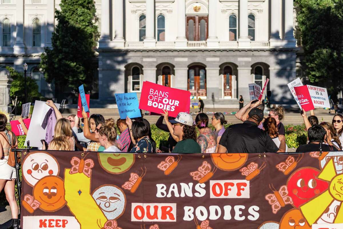 Abortion rights protesters demonstrate at the state Capitol on June 24 after the Supreme Court overruled Roe v. Wade.