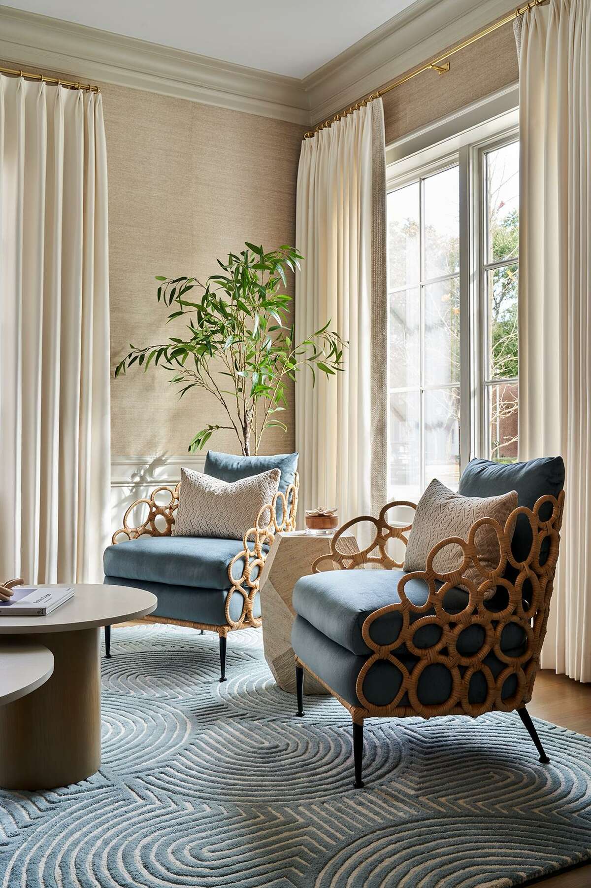 Tiffany Nguyen loves the style of Palecek furniture, and added a pair of the brand’s chairs to the formal living room.