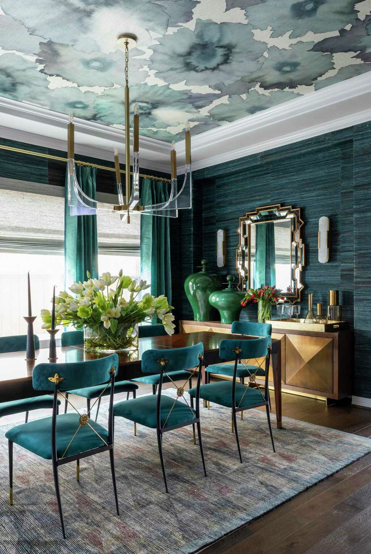 Teal wallcoverings and upholstery factor heavily into the formal living room and dining room.