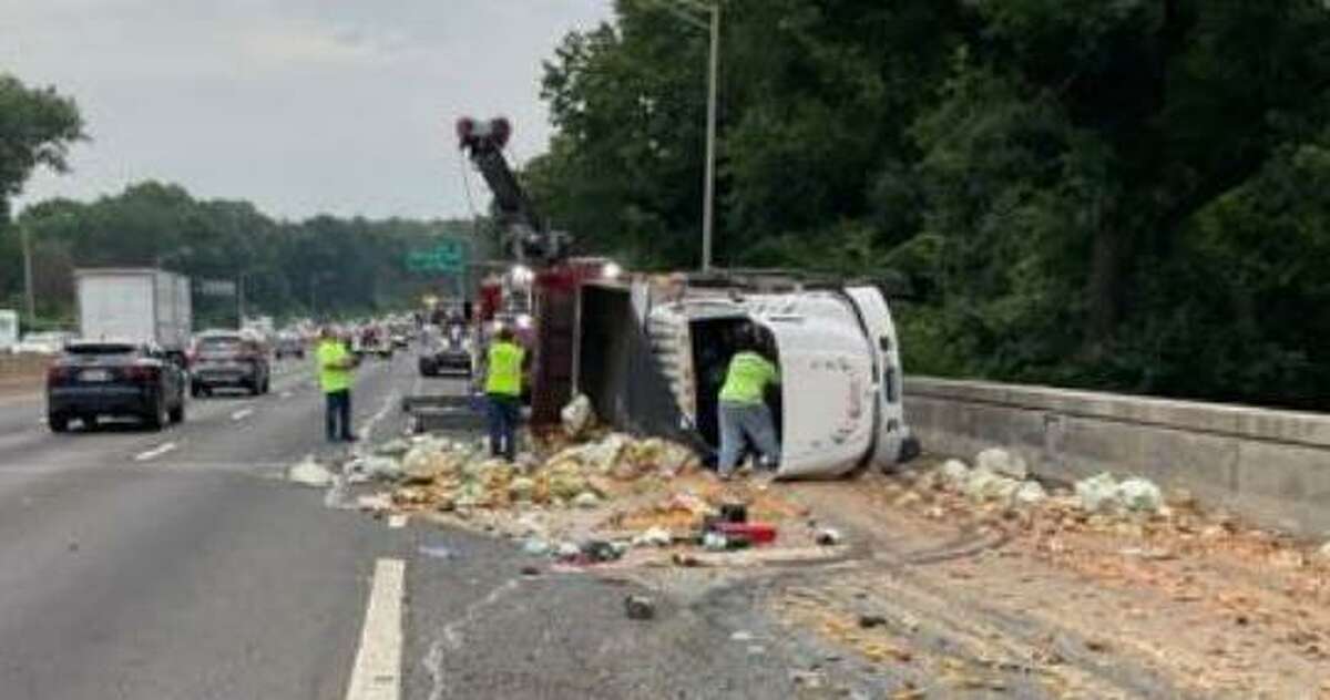 A truck carrying compostable waste overturned Tuesday morning on Interstate 95 in Greenwich, according to state officials.