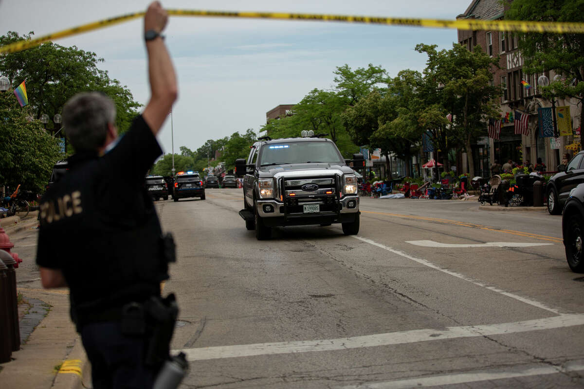 HIGHLAND PARK, IL - JULY 04: First responders work the scene of a shooting at a Fourth of July parade on July 4, 2022 in Highland Park, Illinois. Reports indicate at least five people were killed and 19 injured in the mass shooting. (Photo by Jim Vondruska/Getty Images)