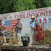 Stringed instruments of all shapes and sizes can be found at the Pickin' and Fiddlin' contest in Roxbury on July 9. Pictured are contestants performing during the 2019 contest.