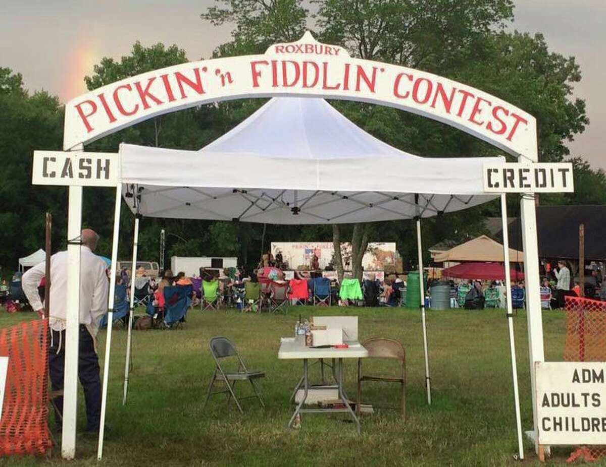 Stringed instruments of all shapes and sizes can be found at the Pickin' and Fiddlin' contest in Roxbury on July 9, 2022. Pictured is the welcome gate at the 2019 contest.