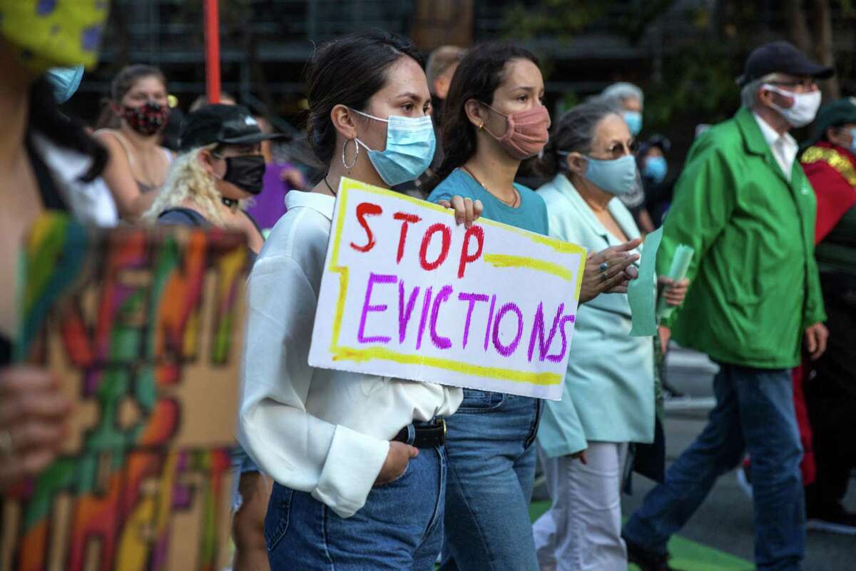 Here's why SF is pausing rent relief applications for thousands of residents. FILE -People hold signs as they march on Market Street during an event "Bay Area Action to Stop Pandemic Evictions!" to push for lasting renter protections on Wednesday, September 29, 2021. San Francisco, California