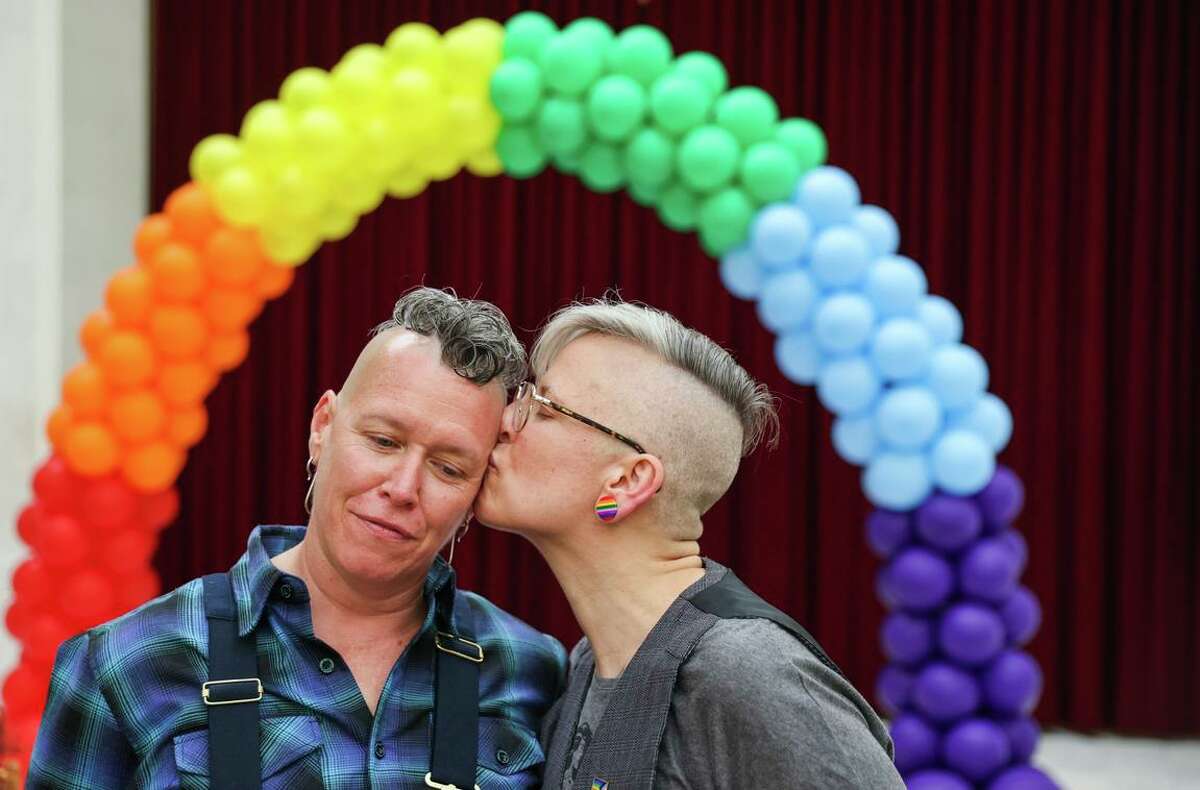 Jak Kazmarek (left) and Danni Fox moments after getting married at City Hall on June 24. LGBTQ leaders want Prop. 8 out of the state Constitution in case the Supreme Court overturns marriage equality.