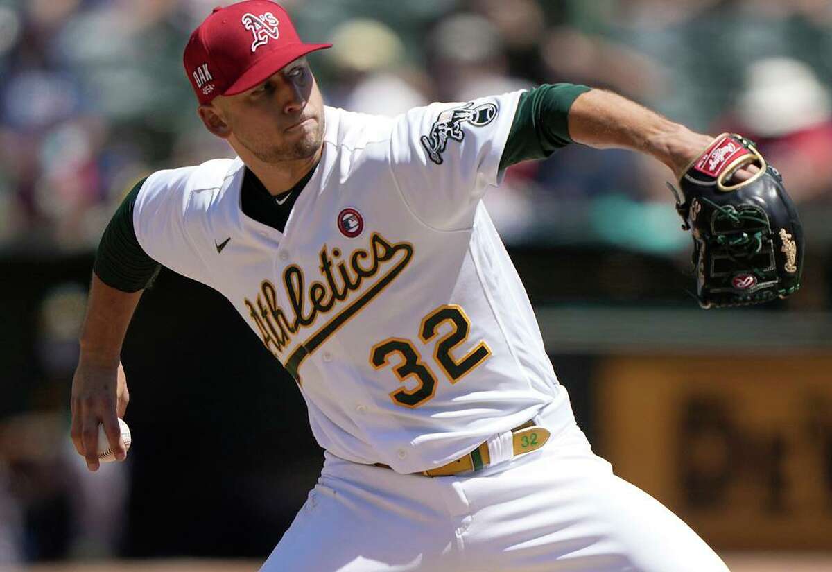 James Kaprielian (32) of the Oakland Athletics pitches against the Boston Red Sox in the top of the sixth inning at RingCentral Coliseum on Sunday, July 4, 2021 in Oakland, California. Kaprielian helped the A's top the Mariners in Seattle on Friday, July 1, 2022. (Thearon W. Henderson/Getty Images/TNS)