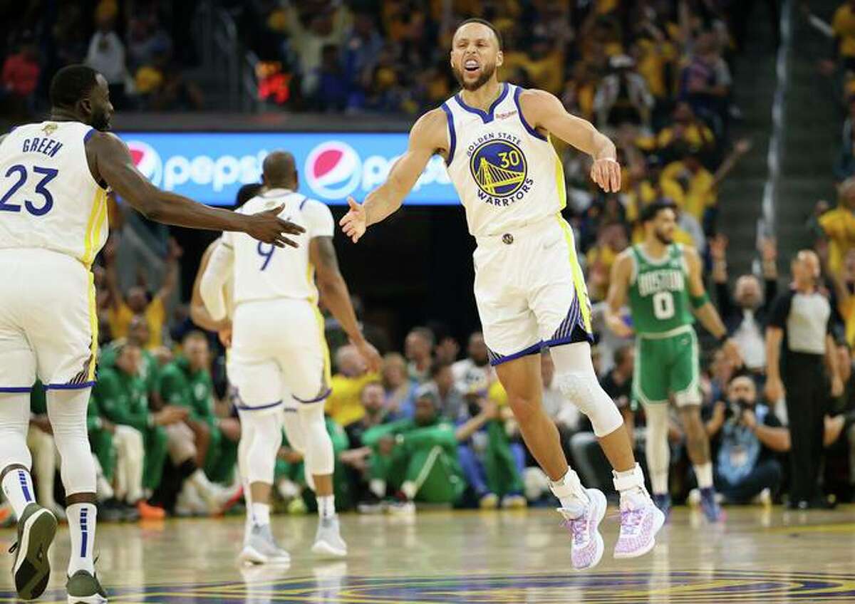 Stephen Curry reacts to one of his NBA-record six first-quarter 3-pointers against Boston during Game 1 of the NBA Finals on June 2.