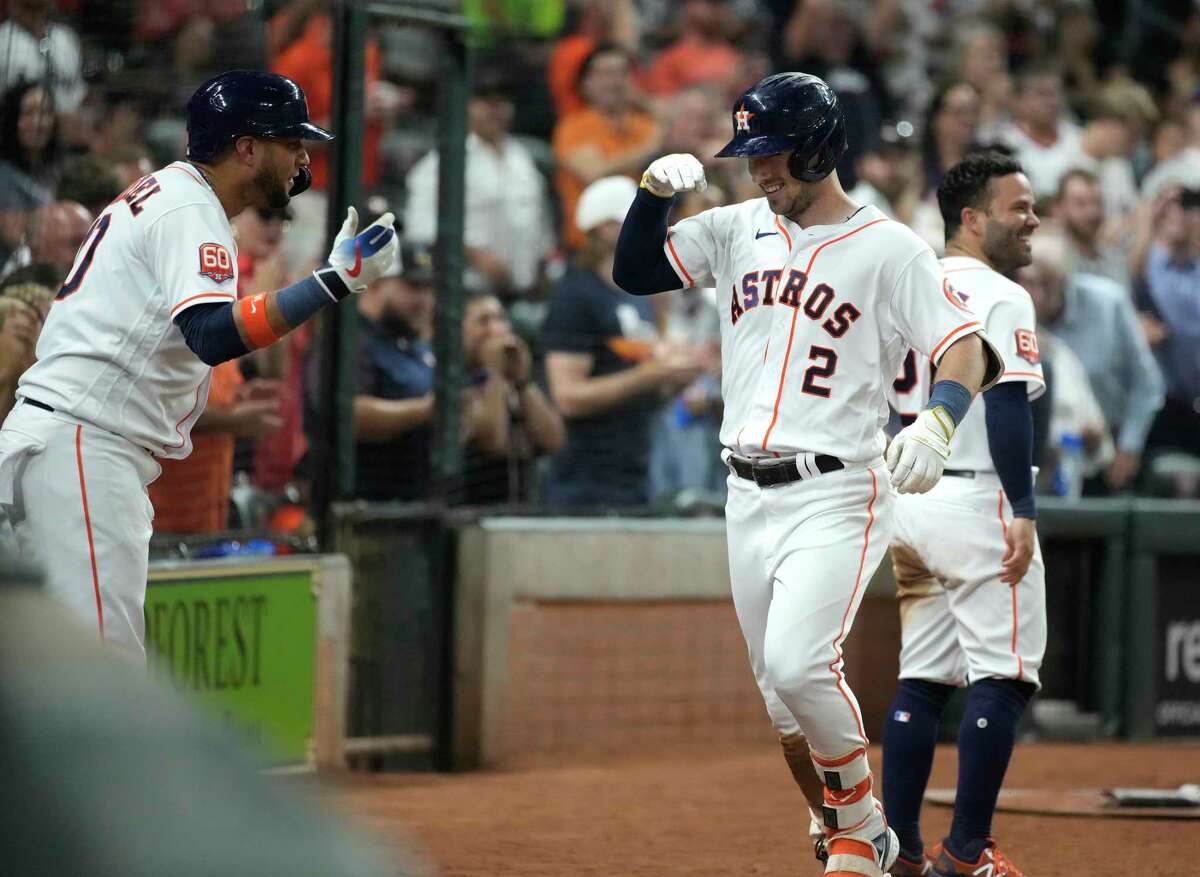 Alex Bregman (2) celebrates his homer with teammate Yuli Gurriel. The two-run shot off former teammate Zack Greinke gave the Astros the lead for good in Tuesday's 9-7 win at Minute Maid Park.