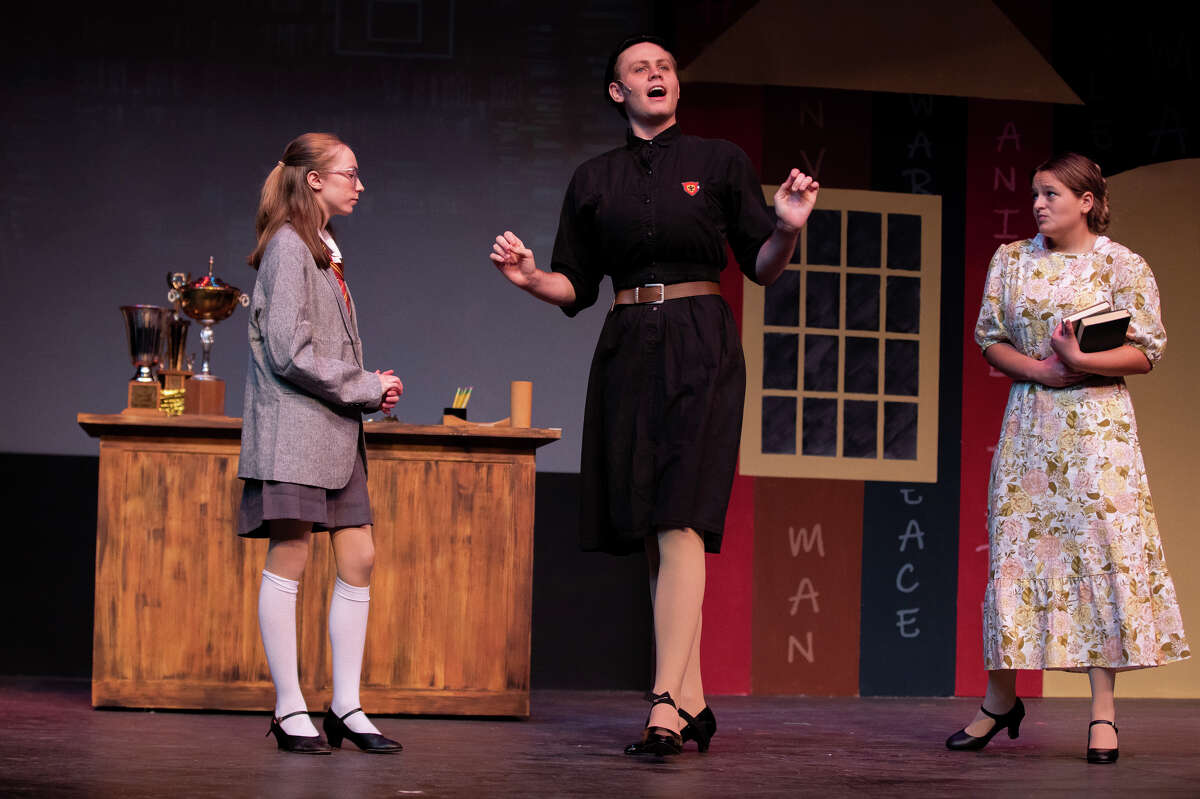 Logan Lawhon as Miss Agatha Trunchbull, center, and Celeste Troschinetz as Matilda, left, and Danna Ferrer de Lamadrid, right, rehearse for Matilda the Musical Tuesday, July 5, 2022, at the Midland Community Theatre.