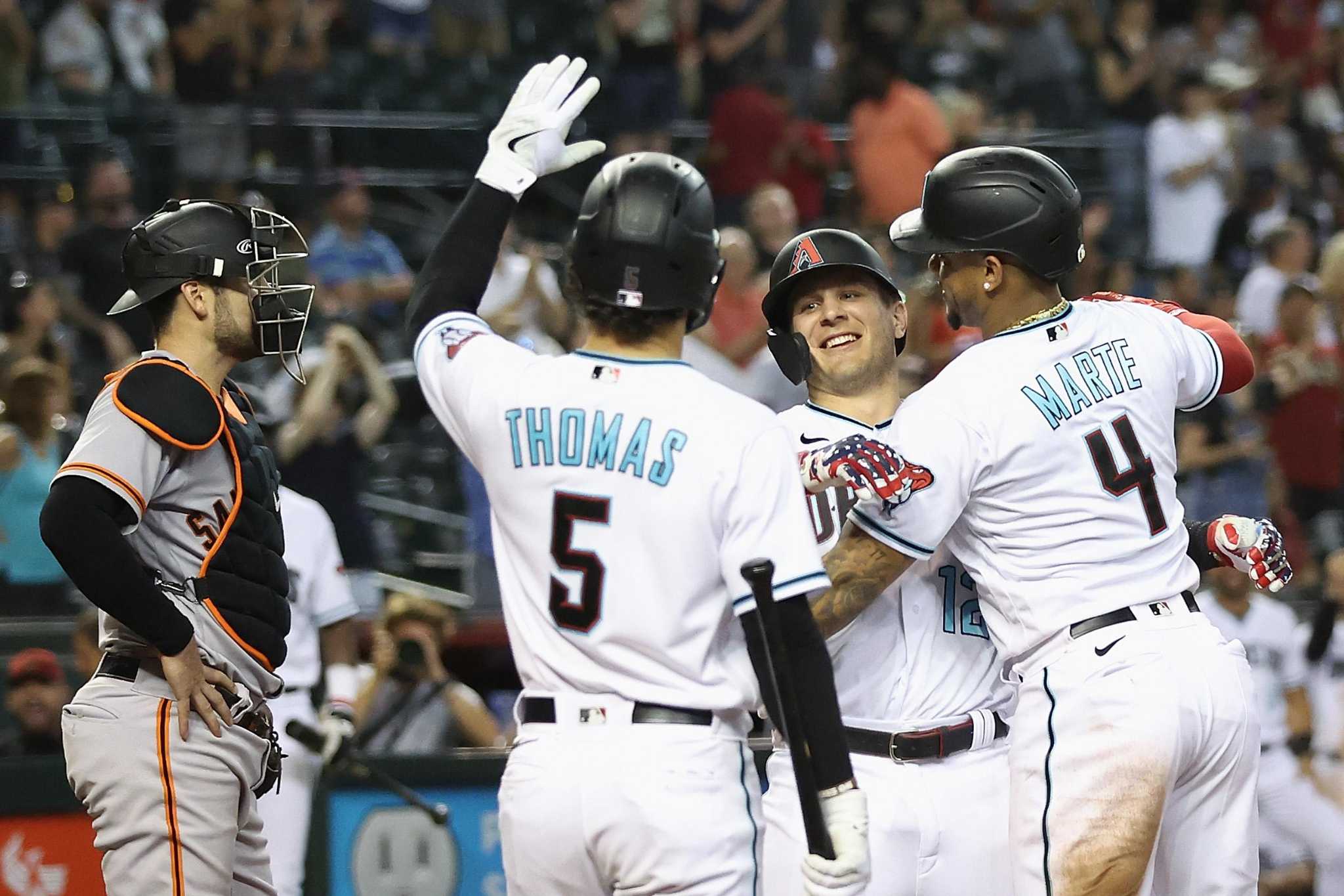 Ketel Marte of the Arizona Diamondbacks slides into third base on a News  Photo - Getty Images