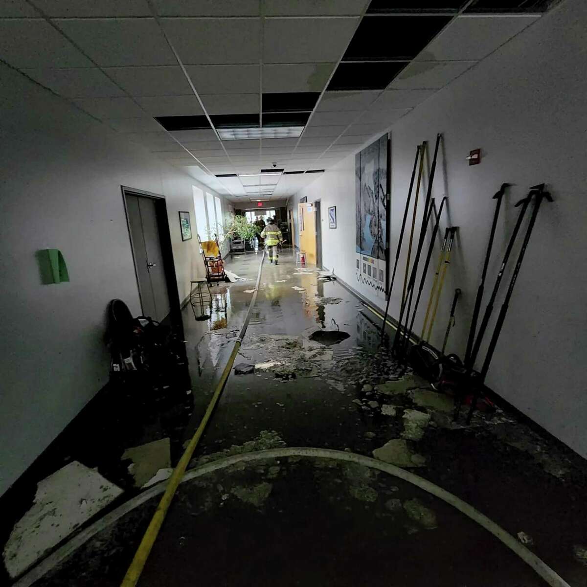 A hallway at New Milford High School sustained water damage after Tuesday’s roof fire.