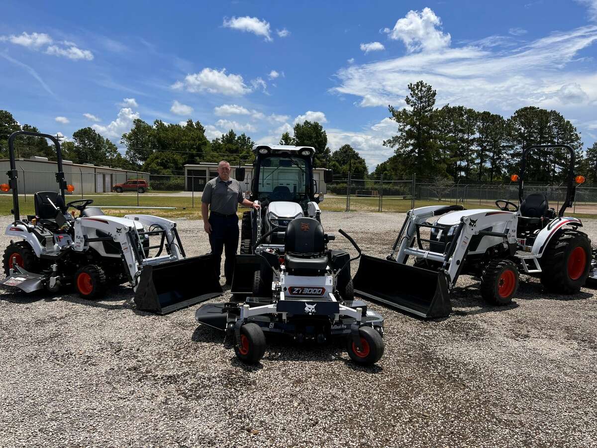 Lake Country Equipment manager Jeff Huckaby with the Bobcat lawn maintenance vehicles now available in Jasper.