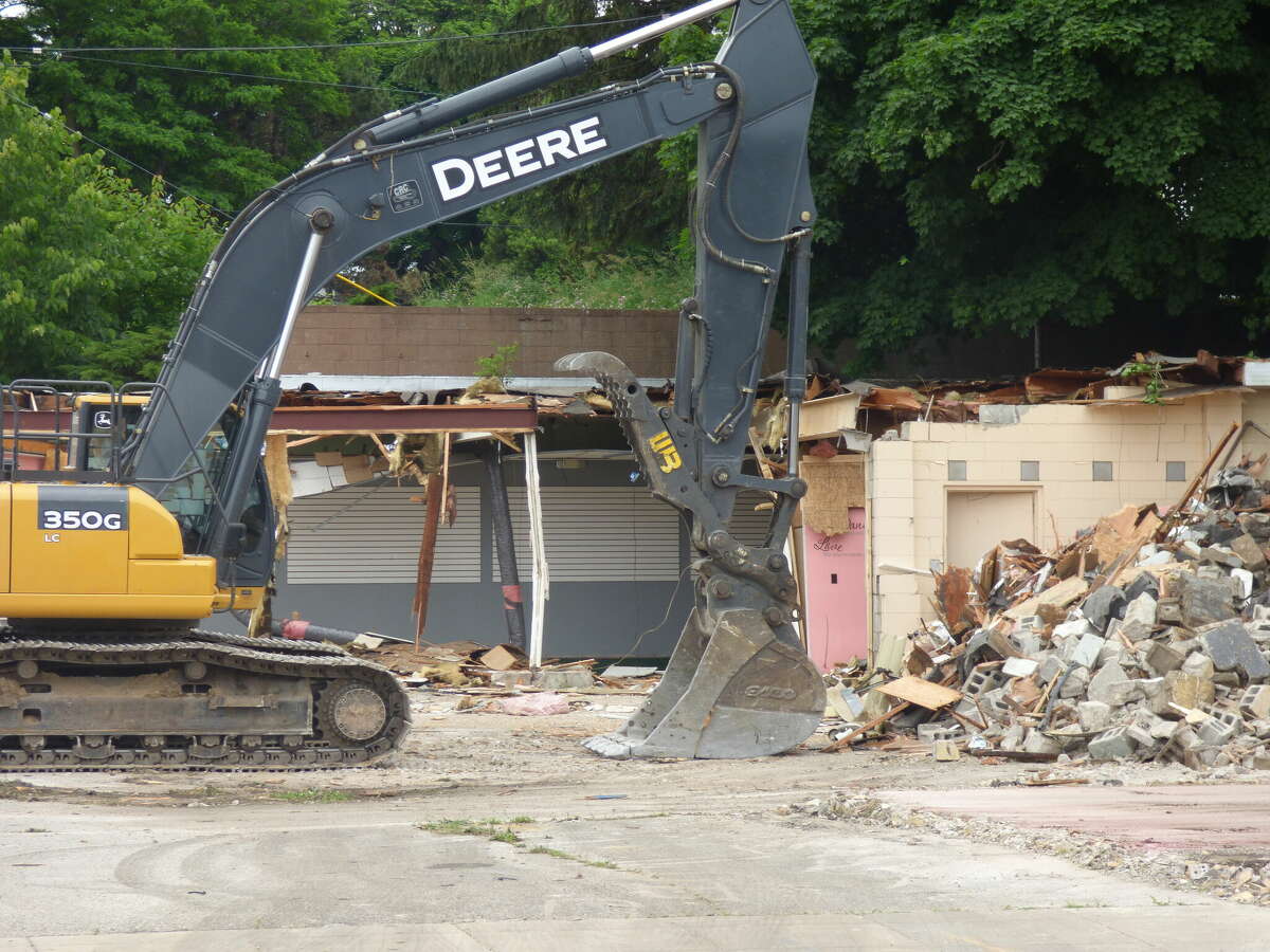 The former American Cleaners building was demolished Wednesday to make way for the new Spirit of the Woods Gateway project. It is the latest of several downtown Manistee buildings to be razed.