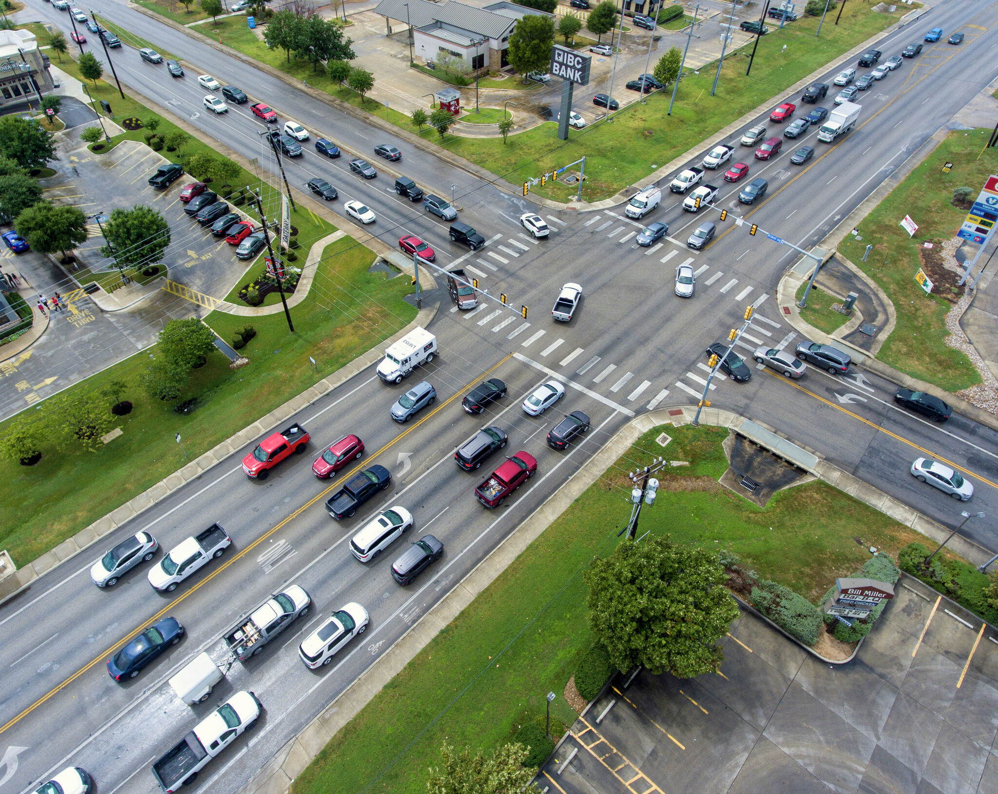 An aerial view of a city intersection with heavy traffic, highlighting potential transportation bottlenecks.