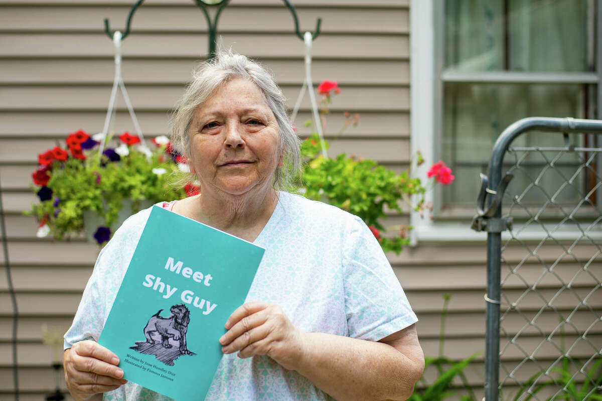 June Dice poses with her newly published children's book, "Meet Shy Guy," on July 5, 2022 near Sanford. Dice wrote the book over 20 years ago.