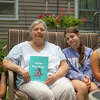 From left to right: Theodore Tasior, June Dice, Danielle Westgate and Madison Heinmiller pose with Dice's newly published book on July 5, 2022 near Sanford. Dice, who is posing with her great-grandchildren, wrote the book over 20 years ago.